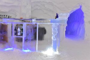Bar carved from ice inside an igloo hotel in Switzerland.