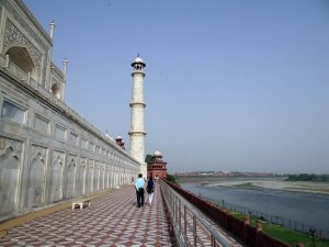 View the Taj Mahal from the deck of the Yamuna River cruise boat