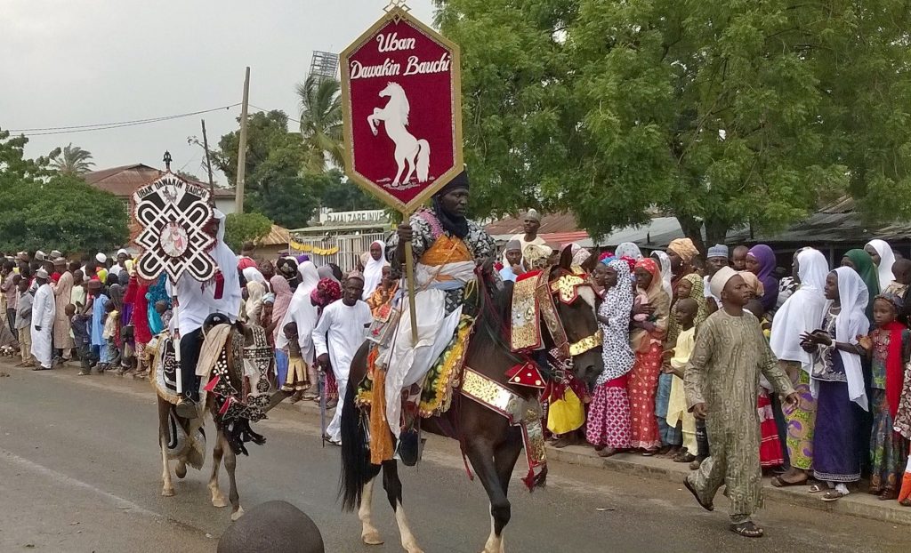 Durbar is a common Eid celebration in Muslim areas of Nigeria. Photo: https://commons.wikimedia.org/wiki/File:Durba_banner_carrier.jpg