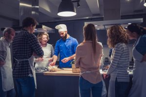 Chef shows students how to prepare Tuscan food