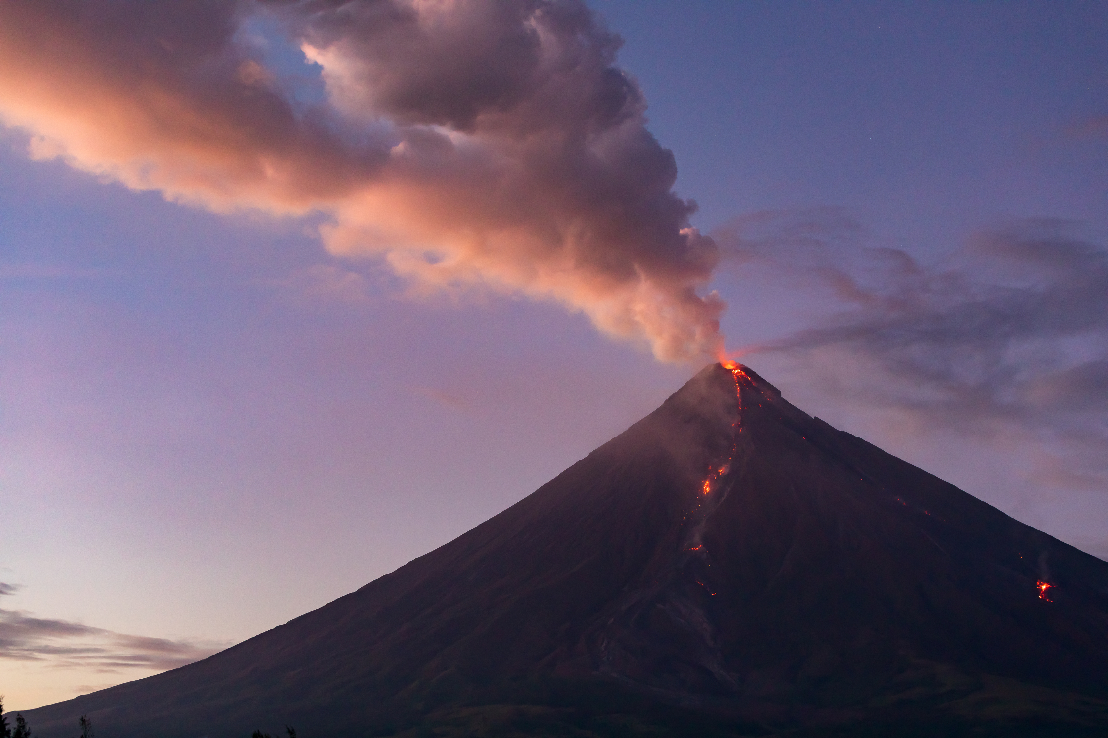 smoking Mayon Volcano at sunset