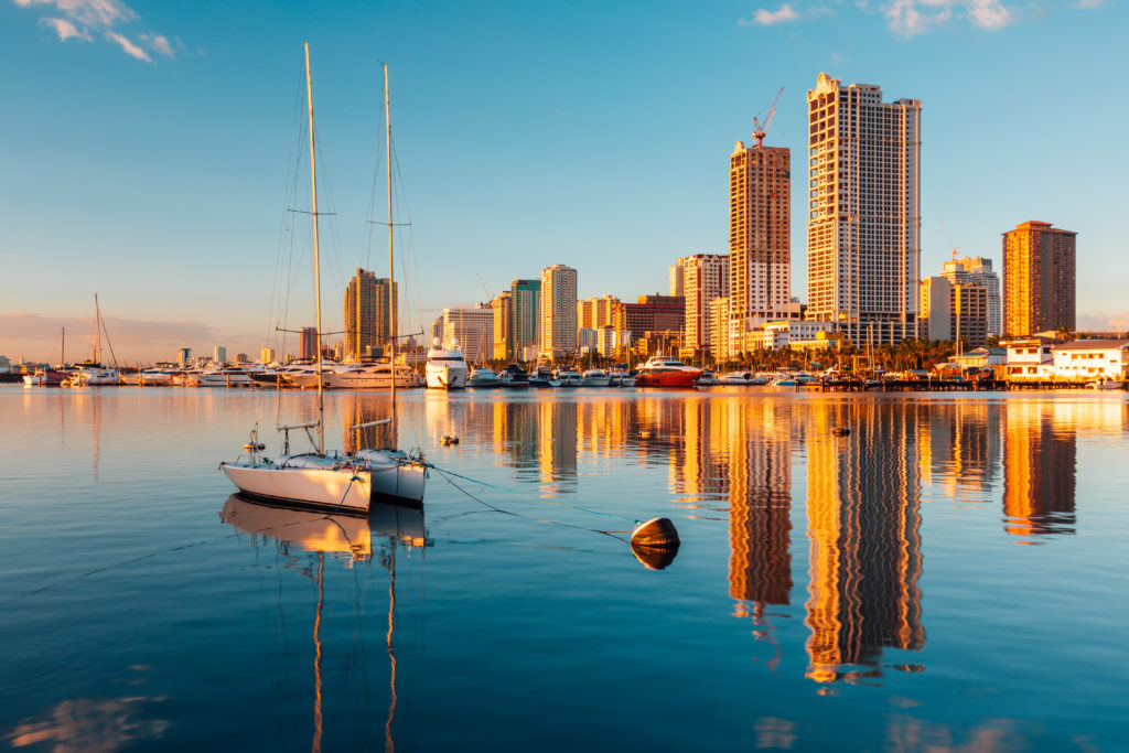 the waterside city of manila philippines with the city in the background where the bourne series was filmed.