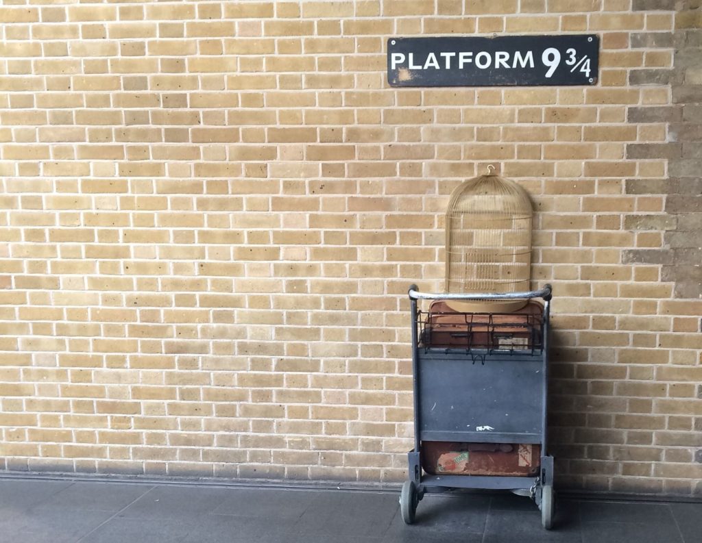 Tour the iconic 9 ¾ platform at Kings Cross Station from the Harry Potter movie series with luggage set props in London, England.