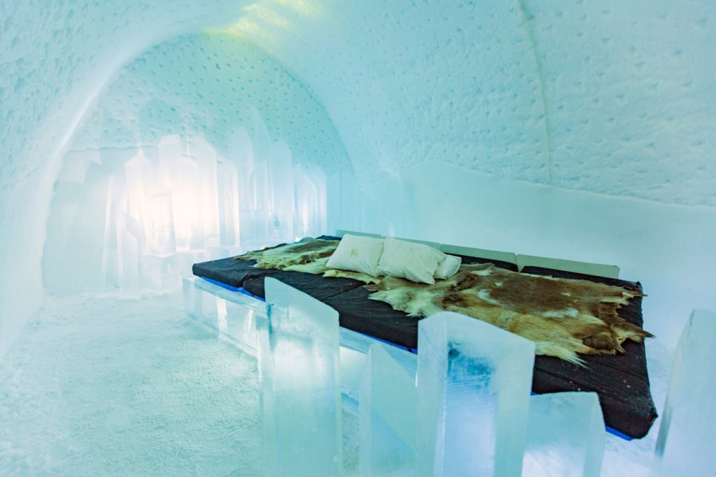 a beautiful and unique special hotel in Sweden made out of ice with an ice bed and art in the room as well as animal skins for your travels with Jaya.
