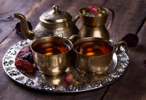 a platter of traditional arabic tea sits on a plate that you can drink when you travel to morocco with Jaya.