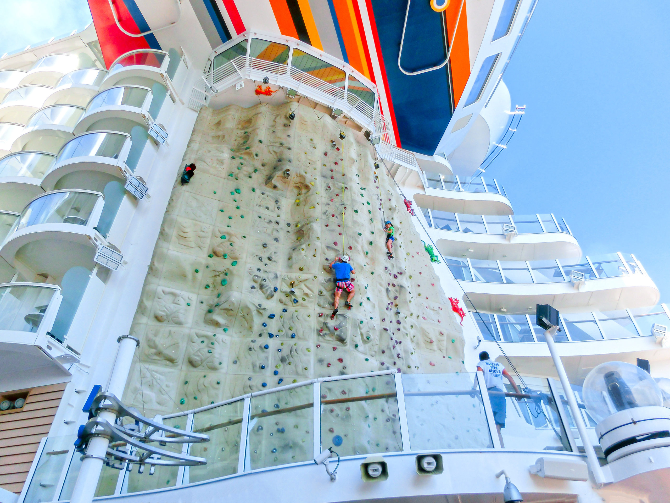 A huge rock climbing wall facing the blue sea is one of the best onboard activities on the Royal Caribbean cruise ships.