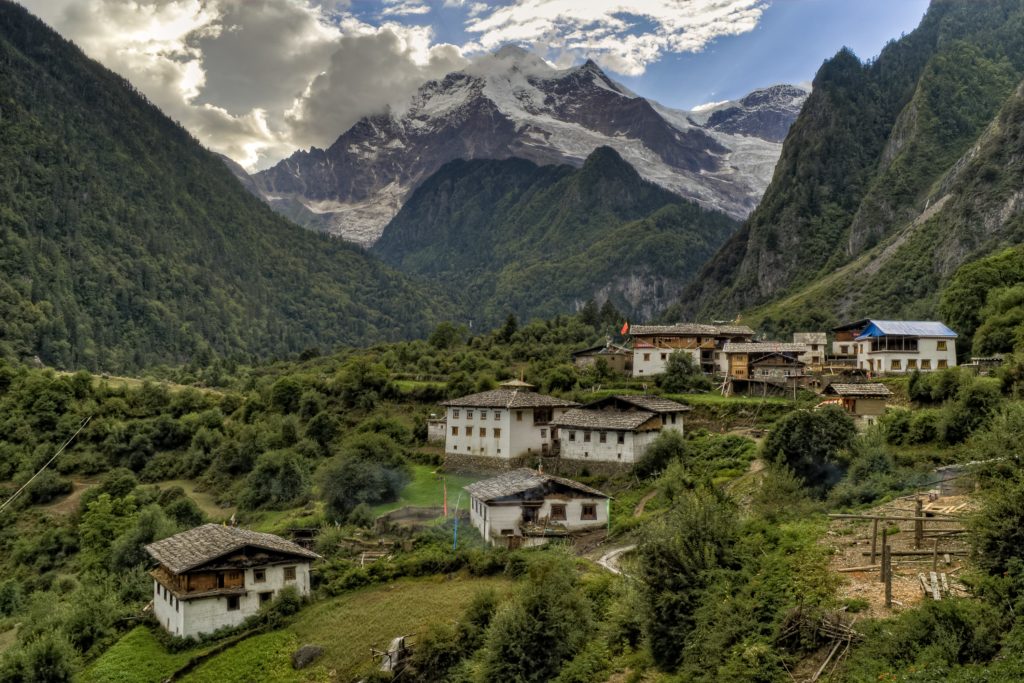 This image of a lush valley and mountain range in Nepal, India, Asia is featured in the Jaya Travel & Tours blog post, "Nepal Travel guide," which describes everything travelers should know before traveling to Nepal.