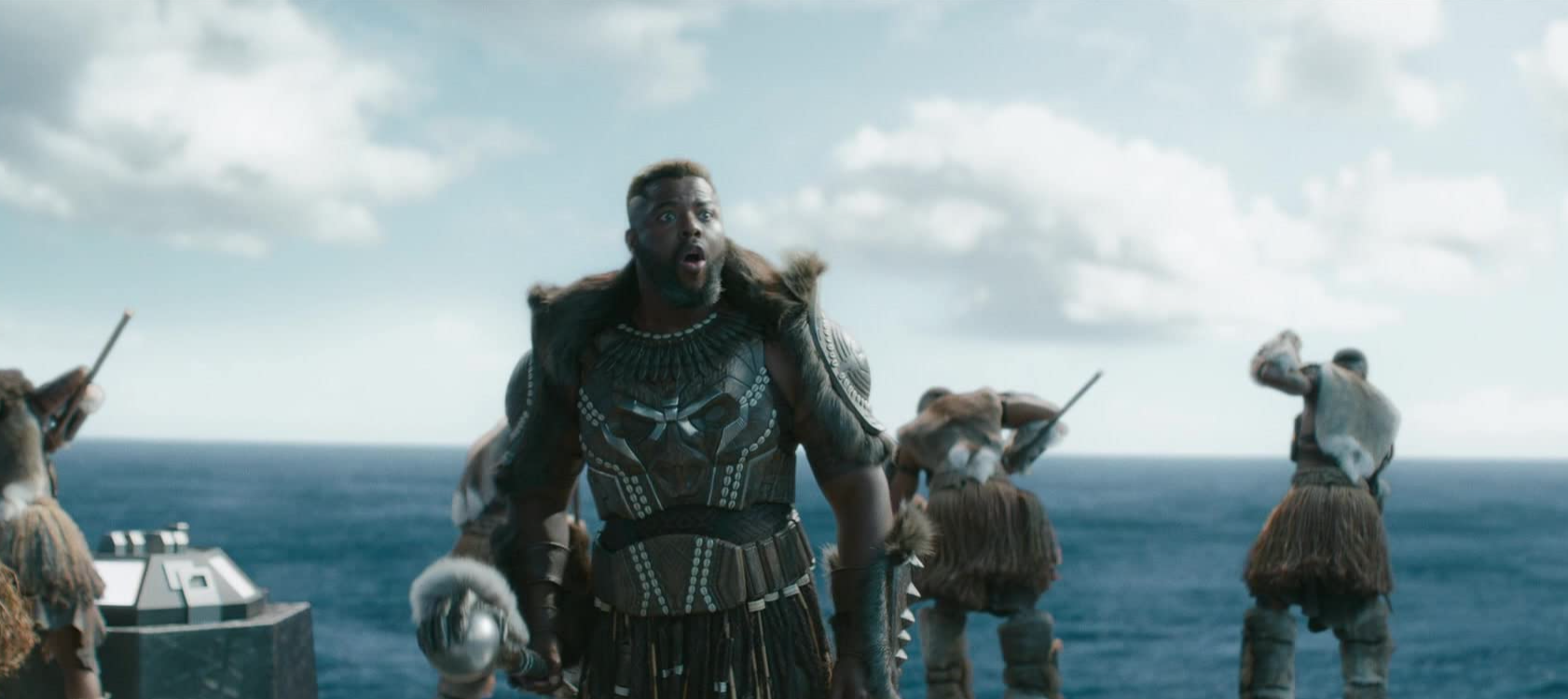 A movie still from the Marvel superhero film with M'baku on top of a boat that was filmed at Mary Ross Waterfront Park in Georgia! This image is featured in the Jaya Travel & Tours blog post, "On Location: Black panther & Wakanda Forever," which lists the filming destinations of the popular marvel movie series.