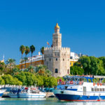 The cityscape of Seville, Spain, which can be seen on the customized Romantic Rhine River cruise from Crosi. This image is featured on the Jaya Travel & Tours cruise booking page, which lists the current river cruises and ocean cruises offered.