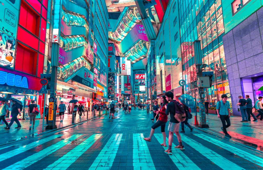 This image of a street in Hong Kong Japan lit up by neon street signs is featutred in Jaya Travel & Tours blog post "Asia Travel Guide"