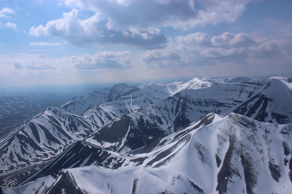 This image of a snowy mountain in Siberia is featured in the Jaya Travel & Tours blog post "Asia Travel Blog"