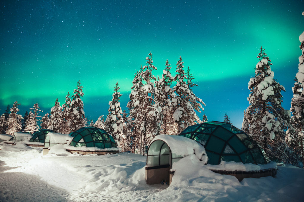 featured in Unique Hotels Around the World by Jaya Travel & Tours, this image is of the Kakslauttanen artic village where you can sleep in a glass igloo under the snow and northern lights.