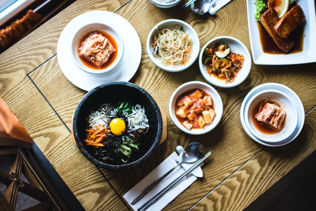 Featured in Korean Cuisine by Jaya Travel & Tours, this image shows a bowl of Bibimbap which is a yummy food from Korea.