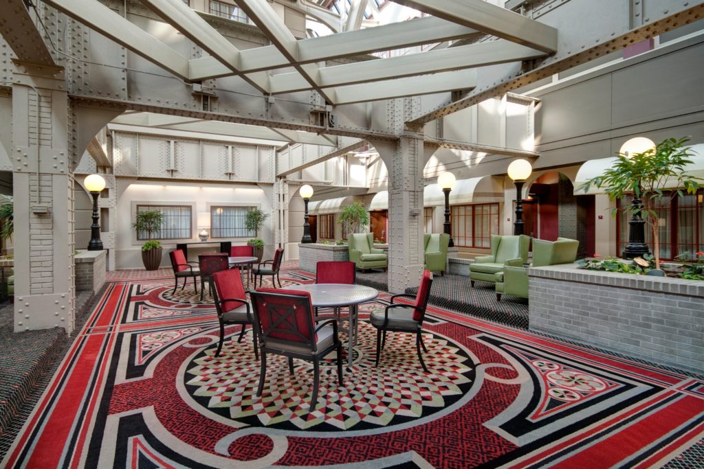 Featured in Unique Hotels Around the World by Jaya Travel & Tours, this image shows the interior of the crowne plaza which used to be a railway station!