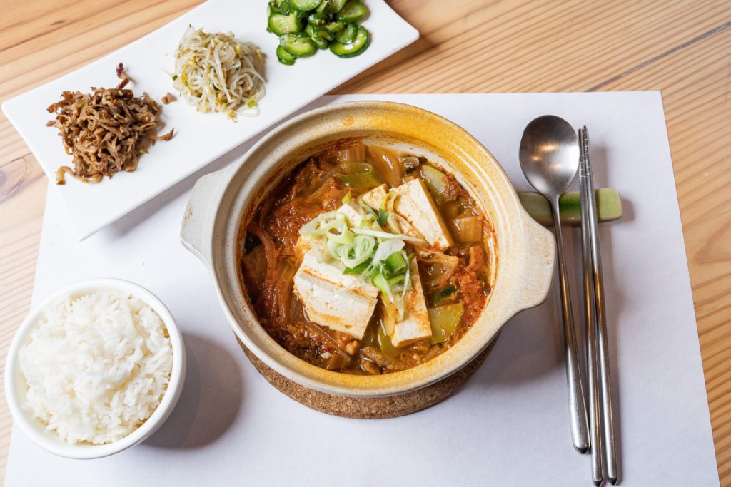 Featured in Korean Cuisine by Jaya Travel & Tours, this image shows a bowl of Dubu-Jorim tofu soup which is a delicacy food in Korea.