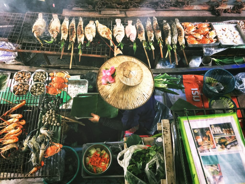 Featured in Korean Cuisine by Jaya Travel & Tours, this image shows a street market in Korea selling seafood.