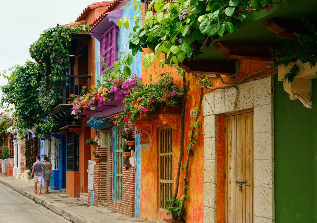 Featured in Winter Travel Destinations by Jaya Travel & Tours, this image shows a colorful street in Cartagena, Colombia.
