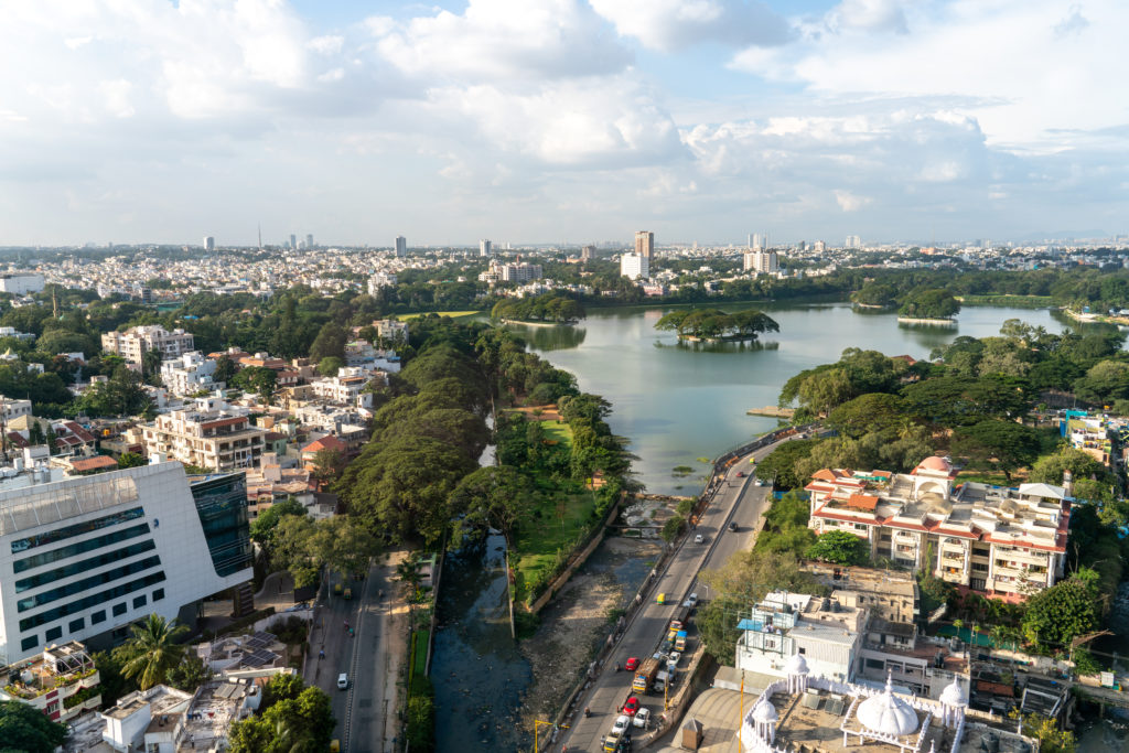 Featured in Futuristic Cities for Vacation by Jaya Travel & Tours, this image shows the city of Bangalore, India which is split in half by a river.