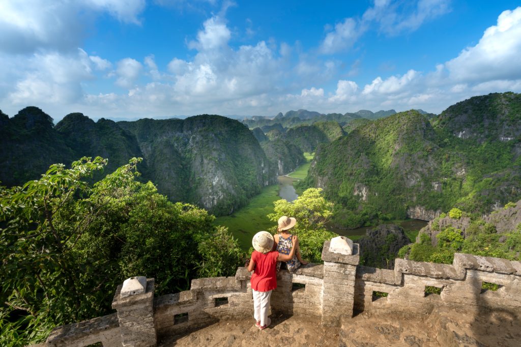 Featured in Responsible Travel Guide by Jaya Travel & Tours, this image shows a tourist at the great wall of china.