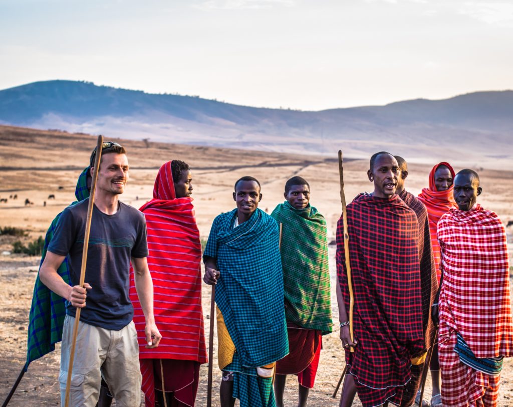 Featured in Responsible Travel Guide by Jaya Travel & Tours, this image shows a group of indigenous people with a tourist.