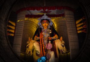 Featured in Durga Puja in Kolkata Guide by Jaya Travel & Tours, this image shows a statue of a Hindu deity.