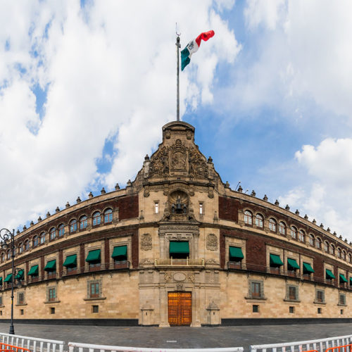 A Jaya Travel & Tours group tour of the exterior view of the National Palace building (Palace Nacional) on the main square in Mexico City, Mexico.