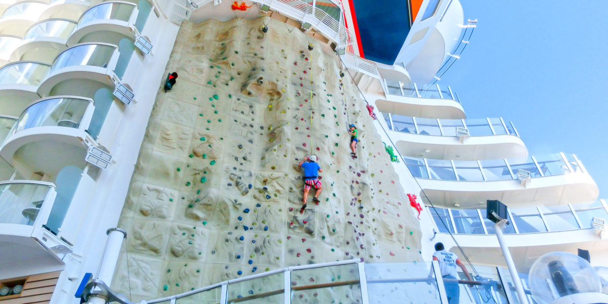 A huge rock climbing wall facing the blue sea is one of the best onboard activities on the Royal Caribbean cruise ships.