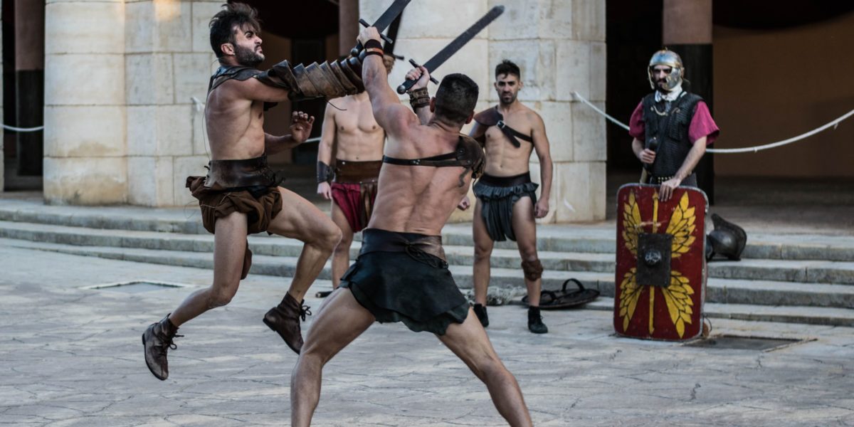 a group of gladiators with swords and gear fight on a street corner like in the movie gladiator.